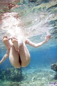 Oversexed Asian Queen Floats In The Water Nude Having Her Birthday