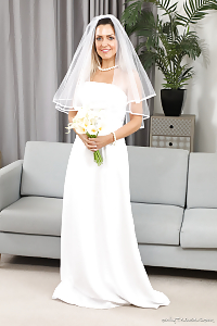 Green-eyed Bride Miss V Smiles Enchantingly As She Takes Off Her Wedding Dress And Reveal Legs In White Stockings