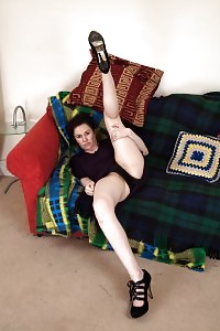 Brunette Xiomara Demonstrates Her Black Panties As She Sits On The Table